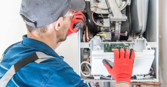 Technician Installing a Furnace